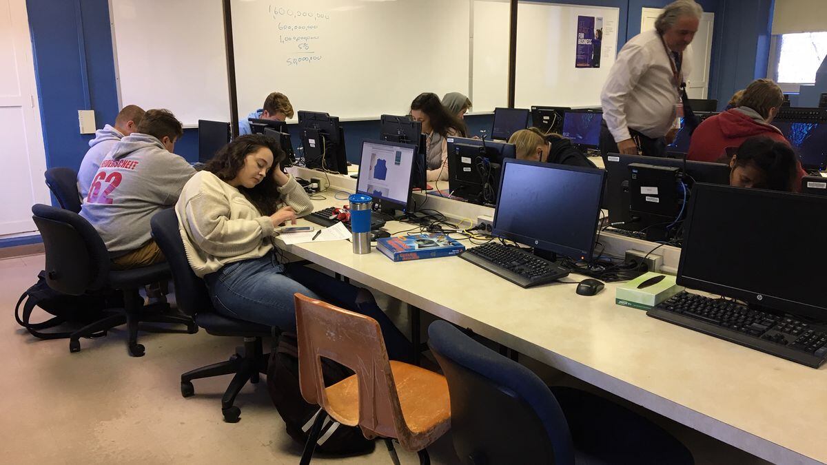 Kids work in a financial literacy course at Dubuque Senior High School on Wednesday, Oct. 24,...