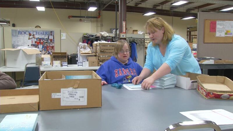 Jessie Warkins, 31, participates in work services at Cottonwood Inc., a Kansas organization...
