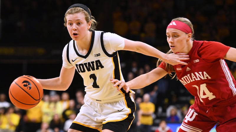 Iowa guard Molly Davis (1) drives past Indiana guard Sara Scalia (14) during the second half...