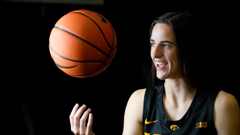 FILE-Iowa guard Caitlin Clark poses for photographers during Iowa's NCAA college basketball...