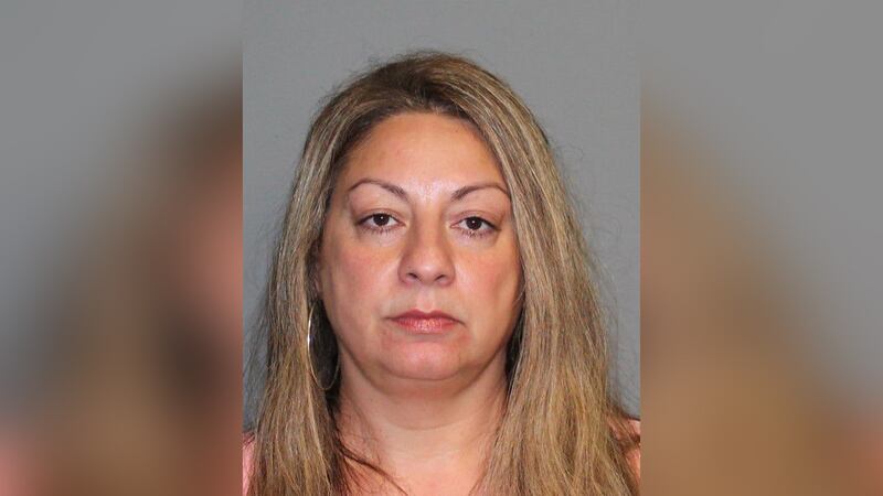 Lisa Daubenhauser is charged with fourth-degree sexual assault and practicing massage therapy...