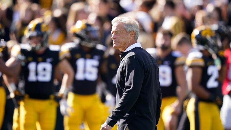 Iowa head coach Kirk Ferentz walks on the field before an NCAA college football game against...