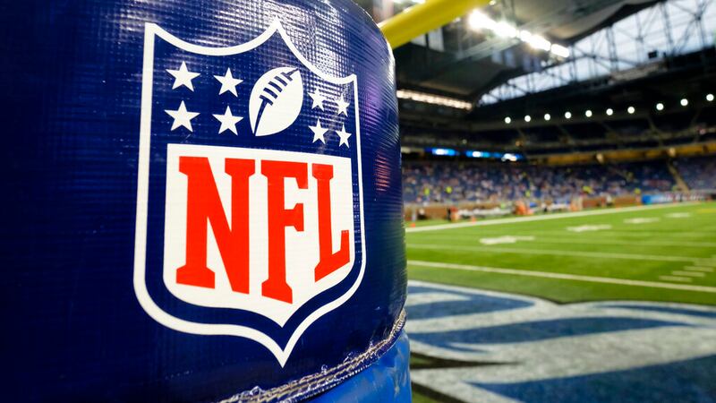 In this Thursday, Aug. 13, 2015 file photo, NFL Logo is seen on the goal post padding before...