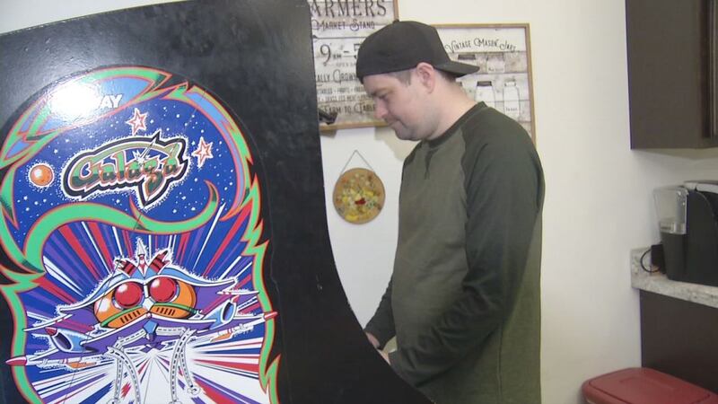 Jordan Dorrington, of Cedar Rapids, plays Galaga, a Japanese card game, in his kitchen. He...