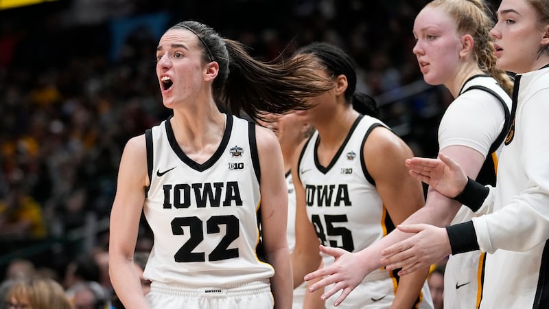 Iowa's Caitlin Clark yells during the first half of the NCAA Women's Final Four championship...