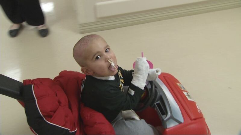 Liam Young, 2, travels through the hallways of the University of Iowa Hospitals and Clinics on...