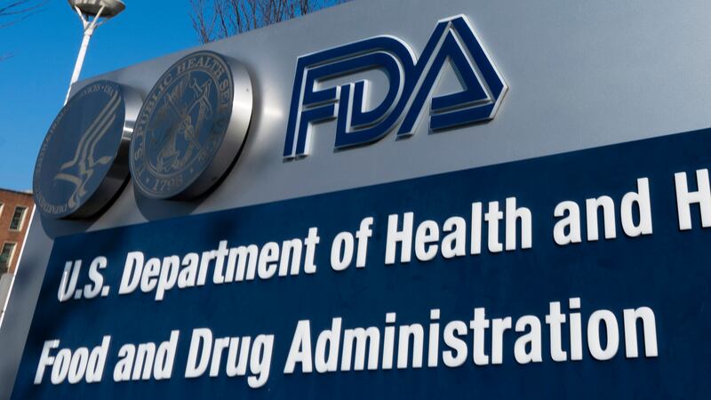 FILE - A sign for the Food and Drug Administration is displayed outside their offices in...