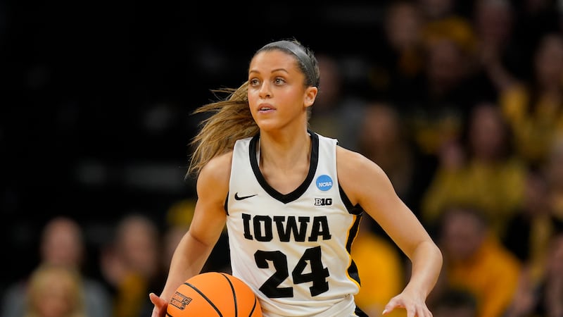 Iowa guard Gabbie Marshall drives up court in the second half of a second-round college...